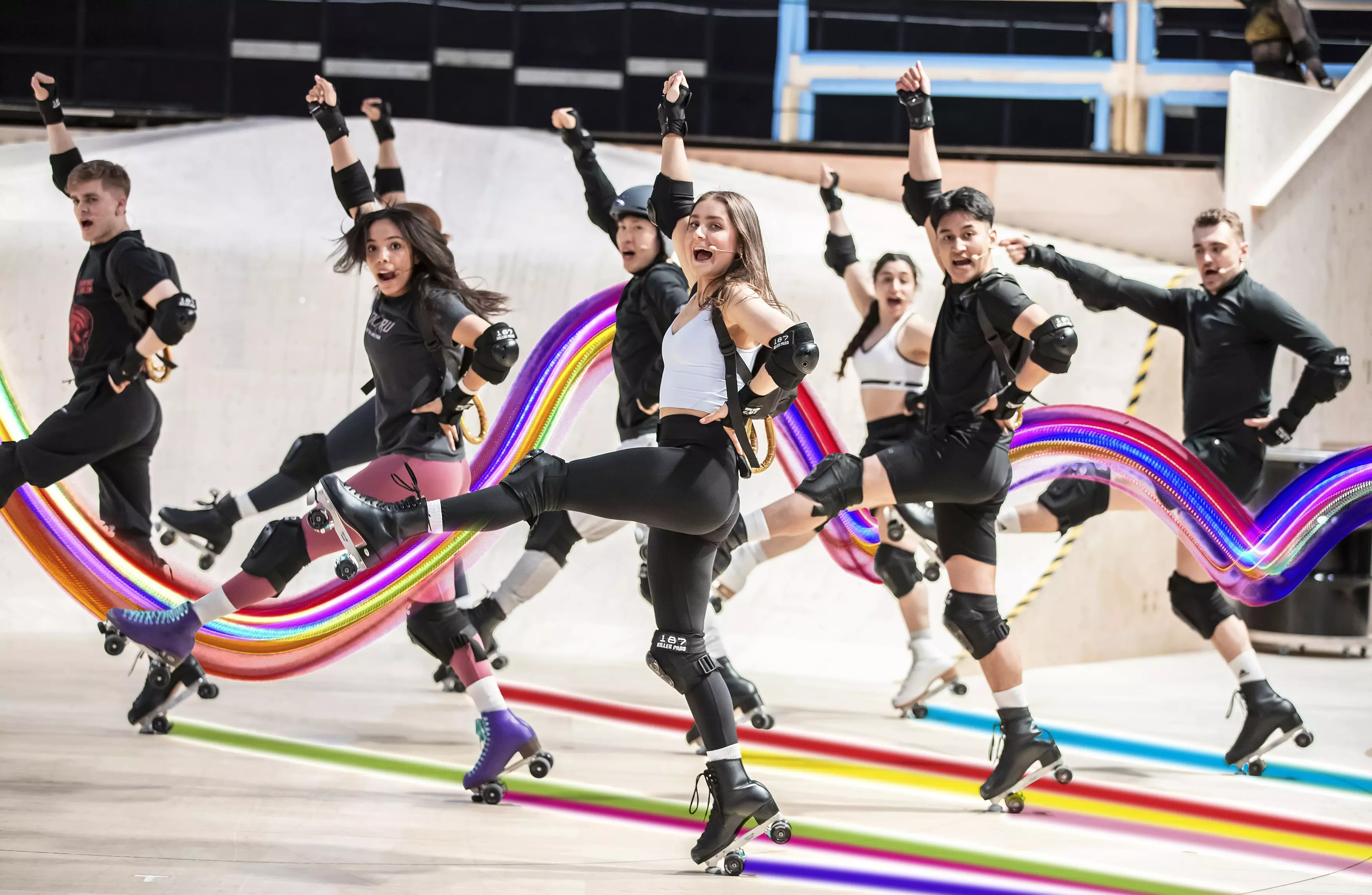 A group of people dancing on ice skates