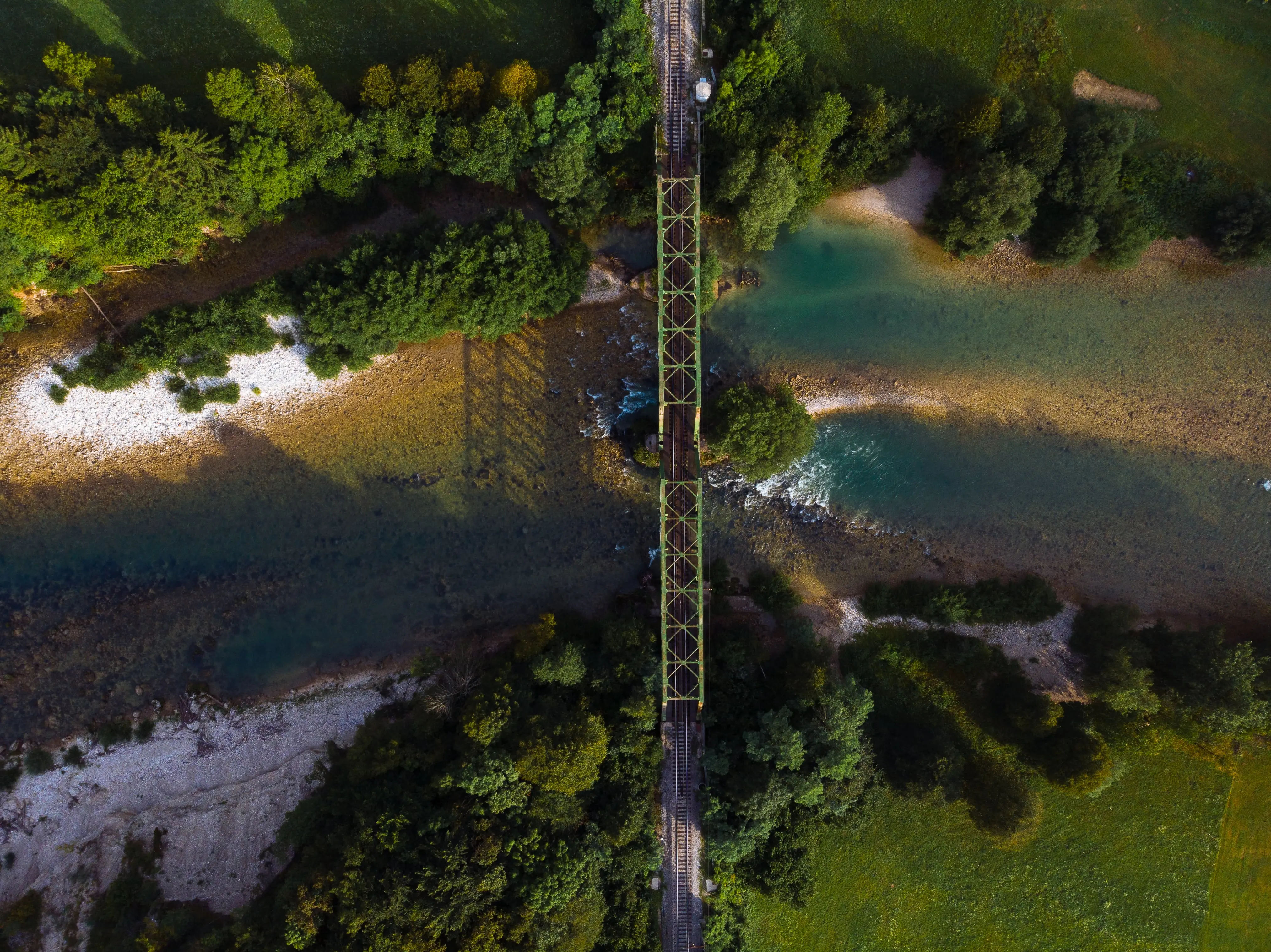 Old Railway Routes: An aerial view of a railway connection over a mountainous river