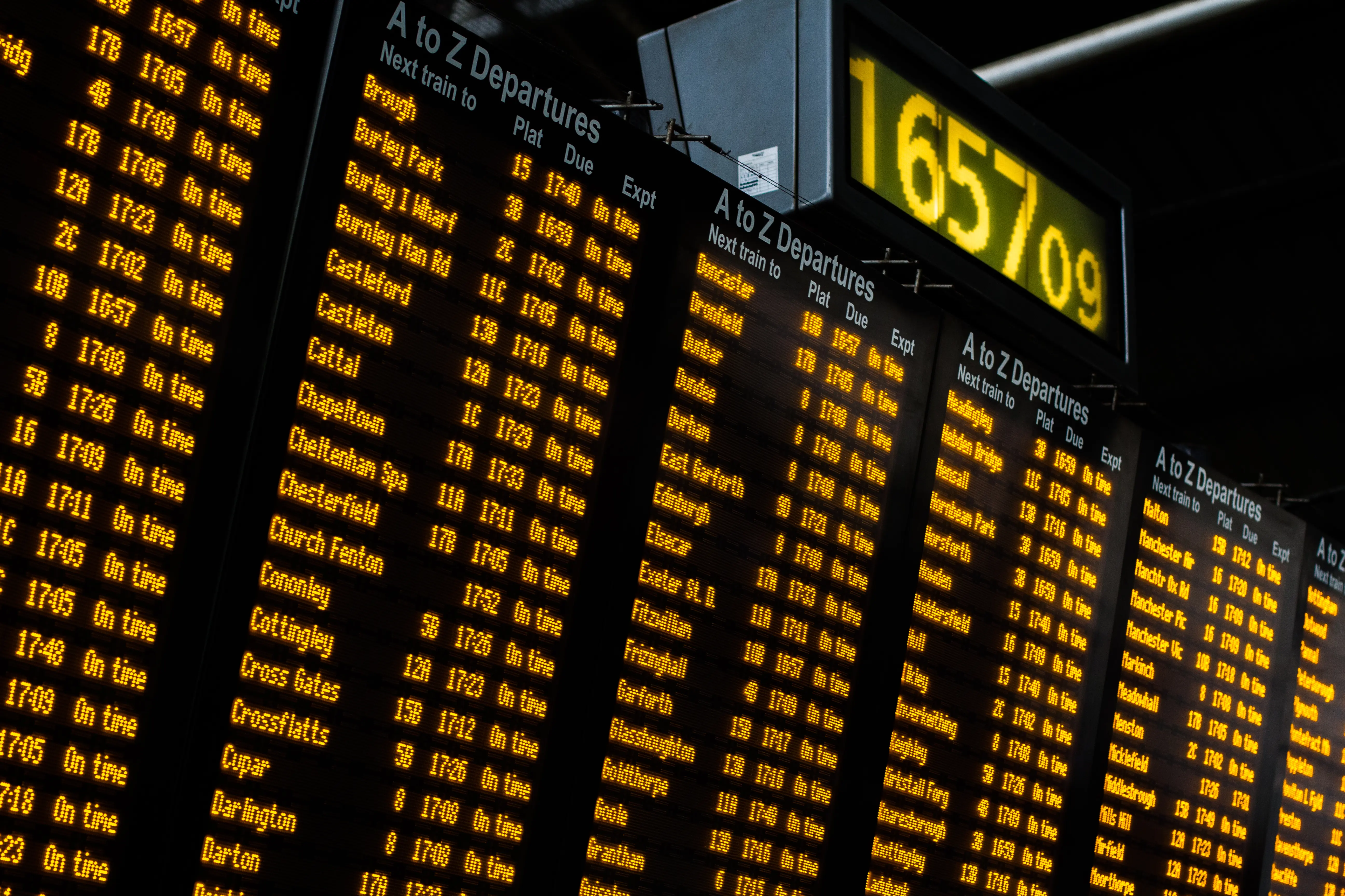 Train Departure Boards: An image of an electronic display, showing a number of departure destinations and times, including Cheltenham Spa and Chesterfield