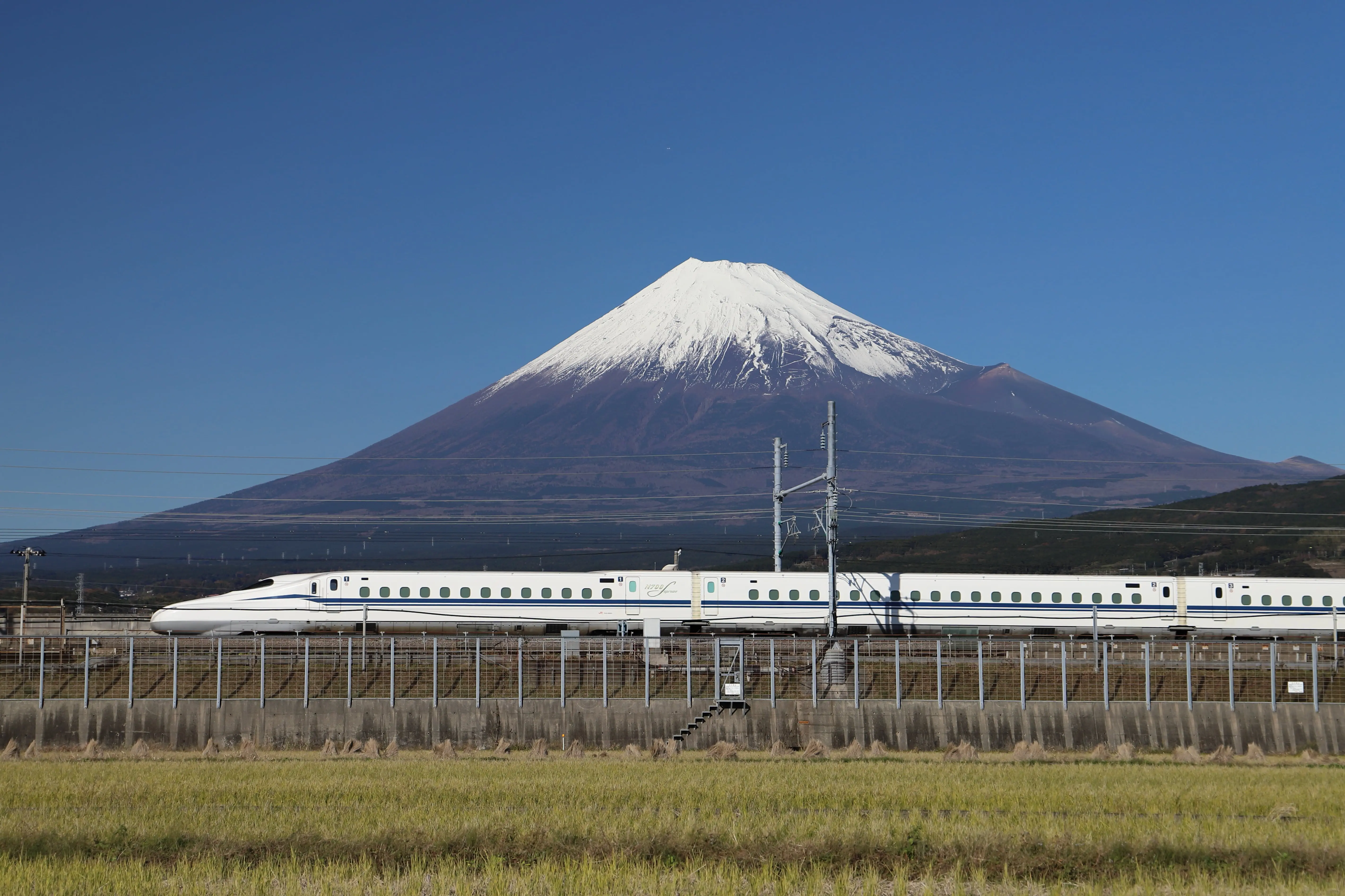 The World’s Most Iconic Trains: A Shinkansen travelling past Mt. Fuji.
