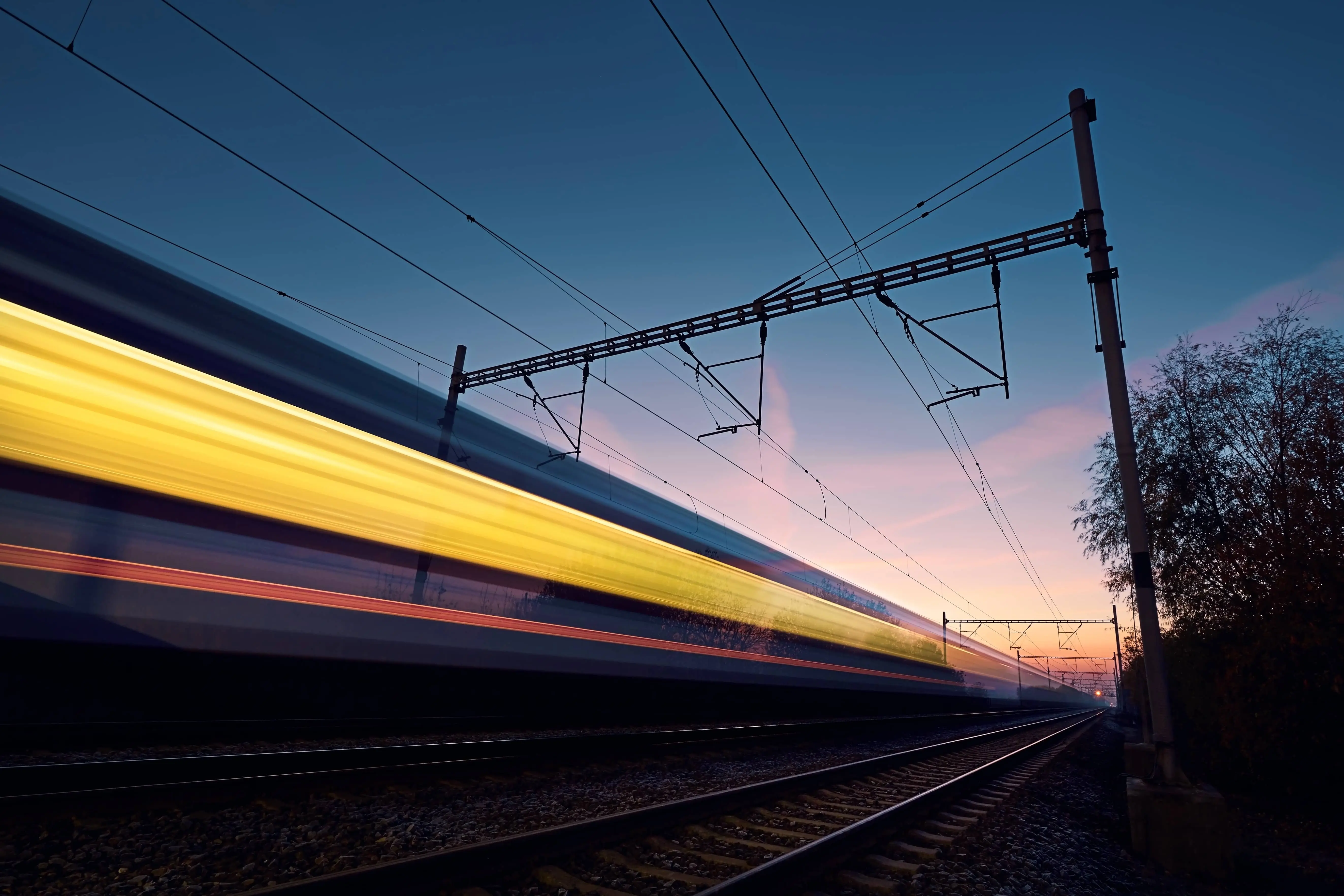 Rail Futures: Long exposure of train on a railroad track.