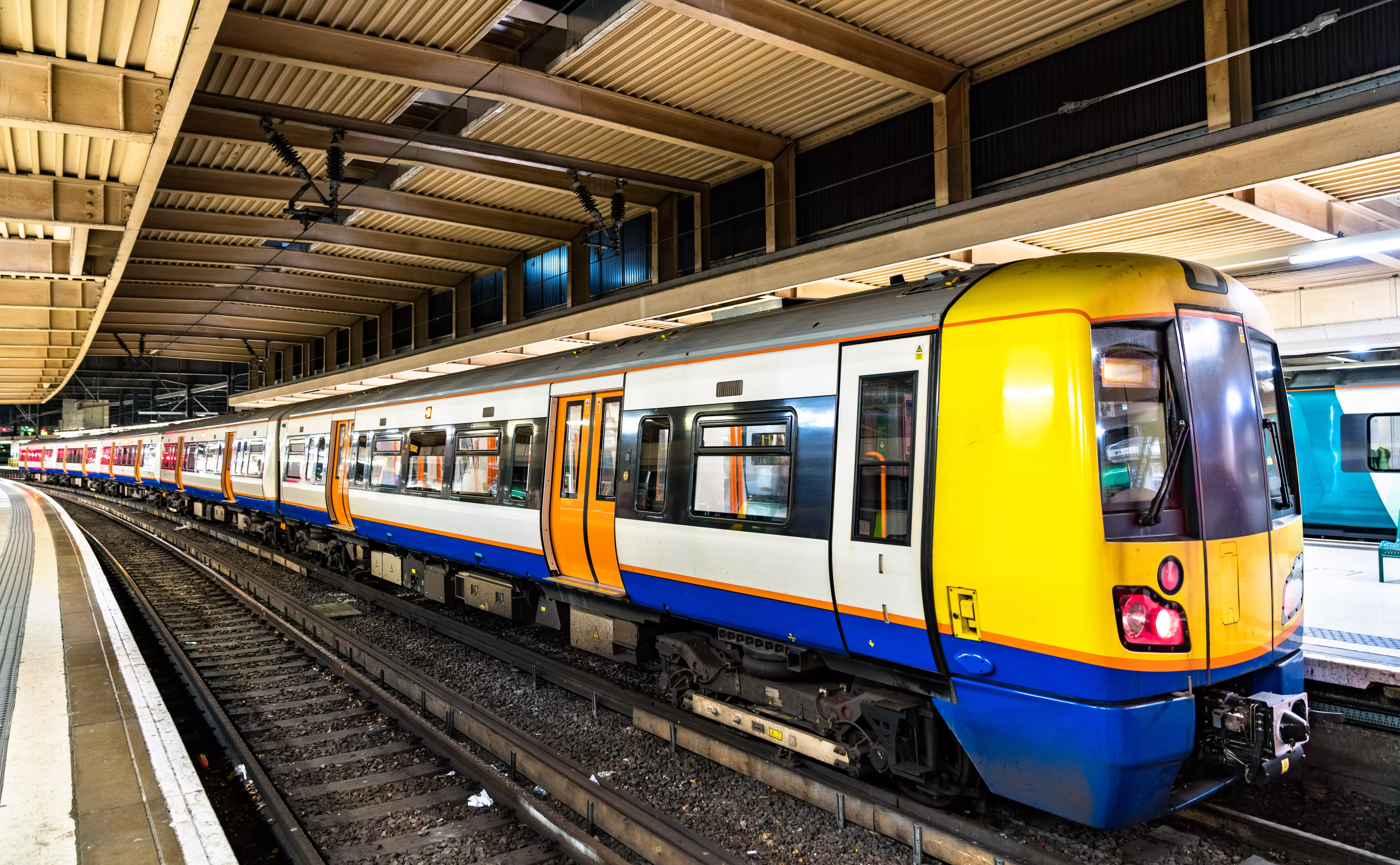 A train waiting at the platform of Euston Overground station.